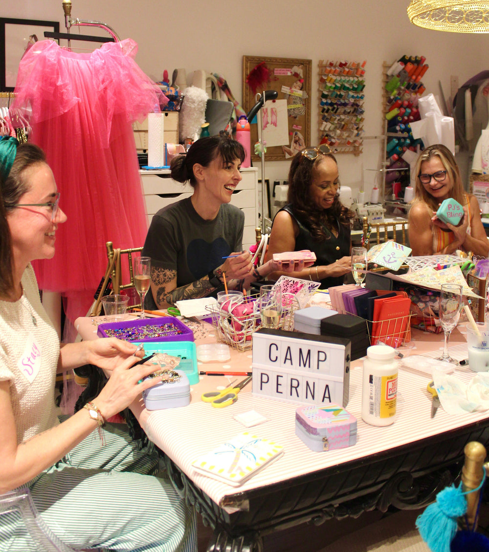 Guests crafting together around a long table at a House of Perna workshop