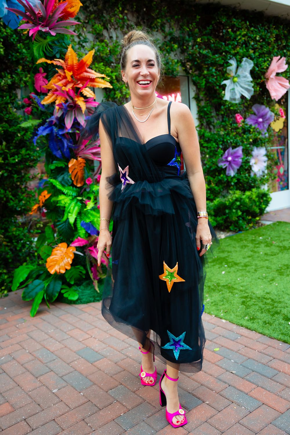 Paige in a black tulle dress with sequin stars