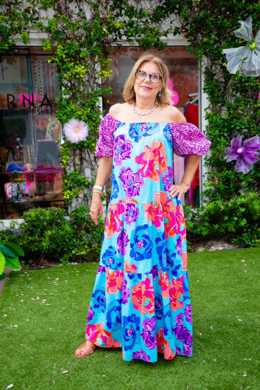 Kae in a floral off-the-shoulder maxi dress