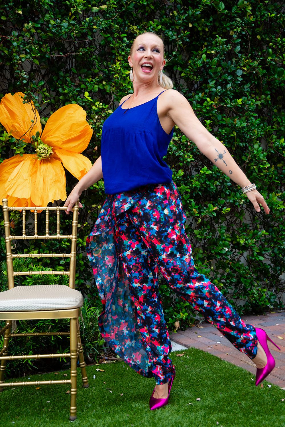 Ashley in printed silk trousers and a cobalt cami